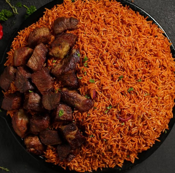 A freshly prepared plate of jollof rice with chicken